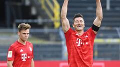 26 May 2020, North Rhine-Westphalia, Dortmund: Football: Bundesliga, 28th matchday, Borussia Dortmund - FC Bayern Munich at Signal Iduna Park. Munich&#039;s Robert Lewandowski cheers for victory alongside Munich&#039;s Joshua Kimmich (l). IMPORTANT NOTE: 