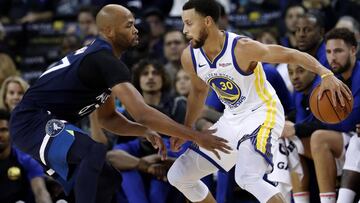 JGM06. Oakland (United States), 30/09/2018.- Golden State Warriors guard Stephen Curry (R) and Minnesota Timberwolves forward Taj Gibson (L) in action during the first half of their NBA preseason game at Oracle Arena in Oakland, California, USA, 29 Septem