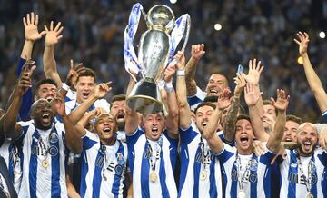 Porto's players celebrate with the trophy after winning the league title following the Portuguese league football match between FC Porto and CD Feirense at the Dragao stadium in Porto on May 6, 2018. 