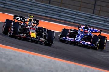 Red Bull Racing's Mexican driver Sergio Perez (L) drives ahead of Alpine's French driver Esteban Ocon during the first practice session ahead of the Qatari Formula One Grand Prix at the Losail International Circuit, in the city of Lusail, on the outskirts of Doha on October 6, 2023. (Photo by KARIM JAAFAR / AFP)