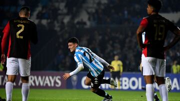 Argentina's Racing Tomas Chancalay (C) celebrates after scoring against Peru's Melgar during the Copa Sudamericana group stage football match, at the Presidente Juan Domingo Peron stadium in Avellaneda, Buenos Aires province, Argentina, on May 18, 2022. (Photo by Luis ROBAYO / AFP)