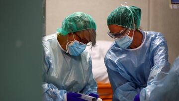 Medical workers take care of a patient infected with COVID-19 at the intensive care unit (ICU) of the Infanta Sofia University hospital amid the coronavirus disease (COVID-19) outbreak in San Sebastian de los Reyes, outside Madrid, Spain October 14, 2020.