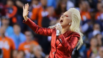 FILE - In this Feb. 7, 2016, file photo, Lady Gaga sings the national anthem before the NFL Super Bowl 50 football game in Santa Clara, Calif. Lady Gaga is reportedly planning an (unconfirmed) stunt during Super Bowl LI by performing from the roof of the stadium during the big game. Advertisers are also ramping up their marketing stunts to try to stand out from the crowd during the biggest live TV event of the year, when the Atlanta Falcons will take on the New England Patriots, in the Super Bowl. (AP Photo/Jae C. Hong, File)