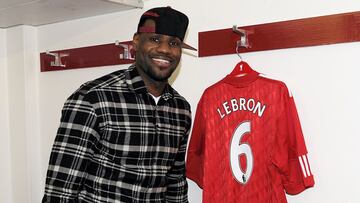 LeBron James poses with a Liverpool shirt.