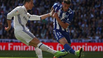 Football Soccer - Real Madrid v Alaves - Spanish La Liga Santander - Santiago Bernabeu Stadium, Madrid, Spain - 02/04/17 - Real Madrid's Cristiano Ronaldo (L) and Alaves' Theo Hernandez in action. REUTERS/Sergio Perez