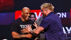 Former US boxer Mike Tyson (L) and YouTube sensation Jake Paul joke during a press conference at the Apollo Theatre in New York, on May 13, 2024. Former heavyweight boxing champion Mike Tyson's July 20 fight against YouTube sensation Jake Paul in Dallas will be a sanctioned heavyweight professional bout, fighters and promoters announced on April 29. The fight will be over eight two-minute rounds with the result to count on the record of both Paul and Tyson, who lost his last official bout in 2005. (Photo by Kena Betancur / AFP)