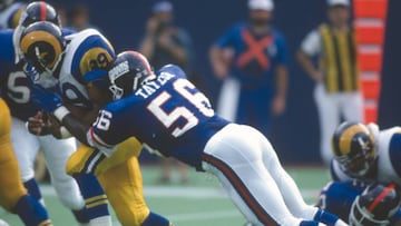 EAST RUTHERFORD, NJ - SEPTEMBER 8:  Lawrence Taylor #56 of the New York Giants tackles Robert Delpino #39 of the Los Angeles Rams during an NFL football game September 8, 1991 at The Meadowlands in East Rutherford, New Jersey. Taylor played for the Giants from 1981-93. (Photo by Focus on Sport/Getty Images) 