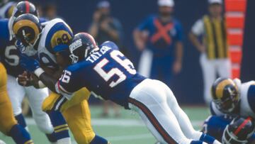 EAST RUTHERFORD, NJ - SEPTEMBER 8:  Lawrence Taylor #56 of the New York Giants tackles Robert Delpino #39 of the Los Angeles Rams during an NFL football game September 8, 1991 at The Meadowlands in East Rutherford, New Jersey. Taylor played for the Giants from 1981-93. (Photo by Focus on Sport/Getty Images) 