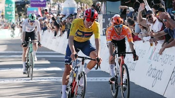 Lidl-Trek Spanish cyclist Juan Ayuso (C) crosses the finish line in first place and wins the Algarve cycling tour, in Alto do Malhao, Loule, on February 22, 2026. (Photo by Jo�o Matos / AFP)
