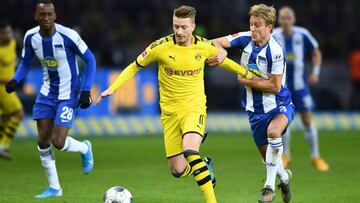 Soccer Football - Bundesliga - Hertha BSC v Borussia Dortmund - Olympiastadion, Berlin, Germany - November 30, 2019 Borussia Dortmund's Marco Reus in action with Hertha BSC's Per Ciljan Skjelbred REUTERS/Annegret Hilse DFL regulations pro