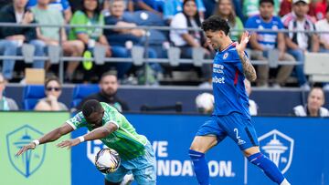 Jul 31, 2025; Seattle, Washington, USA; Cruz Azul defender Jorge Sanchez (2) battles Seattle Sounders defender Nouhou Tolo (5) for the ball during the first half at Lumen Field. Mandatory Credit: Stephen Brashear-Imagn Images