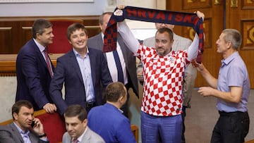 Andriy Pavelko, President of the Football Federation of Ukraine (FFU), attends a session of parliament, while holding a scarf and wearing a jersey of the Croatian national soccer team, in Kiev, Ukraine July 10, 2018. REUTERS/Alex Kuzmin