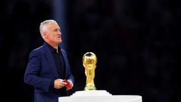Soccer Football - FIFA World Cup Qatar 2022 - Final - Argentina v France - Lusail Stadium, Lusail, Qatar - December 18, 2022 France coach Didier Deschamps looks dejected as he walks past the trophy during the trophy ceremony REUTERS/Hannah Mckay