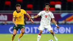 DOHA, QATAR - JUNE 07: Abdullah Ramadan of United Arab Emirates is challenged by Ajdin Hrustic of Australia during the 2022 FIFA World Cup Playoff match between United Arab Emirates and Australia at Ahmad Bin Ali Stadium on June 07, 2022 in Doha, Qatar. (Photo by Mohamed Farag/Getty Images)