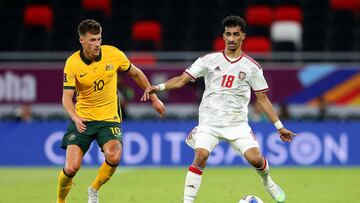 DOHA, QATAR - JUNE 07: Abdullah Ramadan of United Arab Emirates is challenged by Ajdin Hrustic of Australia during the 2022 FIFA World Cup Playoff match between United Arab Emirates and Australia at Ahmad Bin Ali Stadium on June 07, 2022 in Doha, Qatar. (Photo by Mohamed Farag/Getty Images)