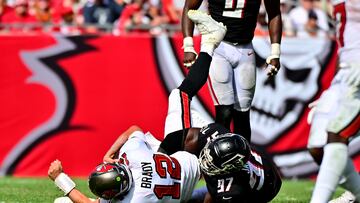 TAMPA, FLORIDA - OCTOBER 09: Grady Jarrett #97 of the Atlanta Falcons sacks Tom Brady #12 of the Tampa Bay Buccaneers during the fourth quarter of the game at Raymond James Stadium on October 09, 2022 in Tampa, Florida.   Julio Aguilar/Getty Images/AFP