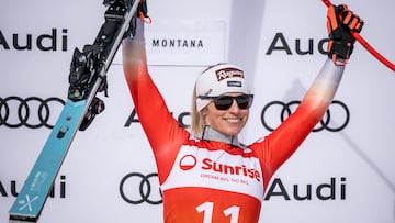 Winner Switzerland's Lara Gut-Behrami celebrates during the podium ceremony of Women's downhill event at the FIS Alpine Ski World Cup in Crans-Montana, on February 16, 2024. (Photo by Fabrice COFFRINI / AFP)