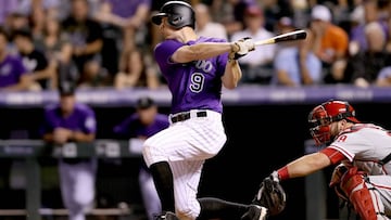 DENVER, CO - AUGUST 04:  D.J. LeMahieu #9 of the Colorado Rockies hits a RBI single in the eighth inning against the Philadelphia Phillies at Coors Field on August 4, 2017 in Denver, Colorado.  (Photo by Matthew Stockman/Getty Images)