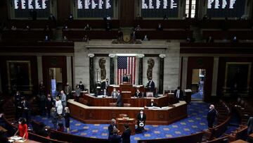 WASHINGTON, DC - JANUARY 13: With the electronic vote tally projected on the wall above, Speaker of the House Nancy Pelosi (D-CA) presides over the vote to impeach U.S. President Donald Trump for the second time in little over a year in the House Chamber 