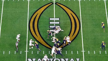 Jan 8, 2024; Houston, TX, USA; A general view as the Michigan Wolverines run the ball against the Washington Huskies during the first quarter in the 2024 College Football Playoff national championship game at NRG Stadium. Mandatory Credit: James Lang-USA TODAY Sports
