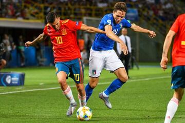 Ceballos (left) vies with Italy's Federico Chiesa during Spain's 3-1 defeat in Bologna.