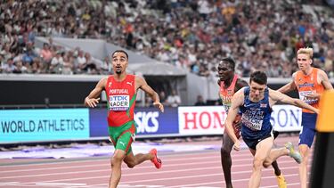 Portugal's athlete Isaac Nader (L) crosses the finish line ahead of second-placed Britain's athlete Jake Wightman (2nd R) and third-placed Kenya's athlete Reynold Cheruiyot (2nd L) in the men's 1500m final during the World Athletics Championships in Tokyo on September 17, 2025. (Photo by Kirill KUDRYAVTSEV / AFP)