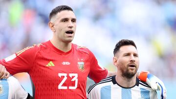 LUSAIL CITY, QATAR - NOVEMBER 22: Emiliano Martinez and Lionel Messi of Argentina stand for the national anthem prior to the FIFA World Cup Qatar 2022 Group C match between Argentina and Saudi Arabia at Lusail Stadium on November 22, 2022 in Lusail City, Qatar. (Photo by Richard Heathcote/Getty Images)