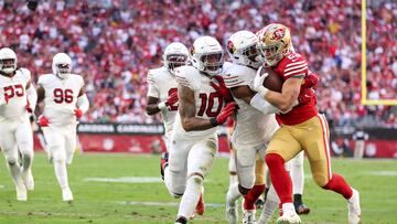 Christian McCaffrey #23 of the San Francisco 49ers, runs with the ball