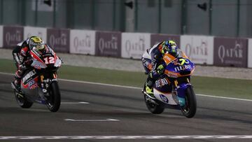 Moto2 - Qatar Grand Prix - Losail International Circuit, Lusail, Qatar - March 10, 2019 Flexbox's Lorenzo Baldassarri and Dynavolt Intact GP's Thomas Luthi cross the finish line during the race REUTERS/Ibraheem Al Omari