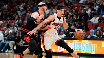 MIAMI, FLORIDA - APRIL 19: Tyler Herro #14 of the Miami Heat dribbles the ball against Alex Caruso #6 of the Chicago Bulls in the first quarter during the Play-In Tournament at Kaseya Center on April 19, 2024 in Miami, Florida. NOTE TO USER: User expressly acknowledges and agrees that, by downloading and or using this photograph, User is consenting to the terms and conditions of the Getty Images License Agreement.   Rich Storry/Getty Images/AFP (Photo by Rich Storry / GETTY IMAGES NORTH AMERICA / Getty Images via AFP)