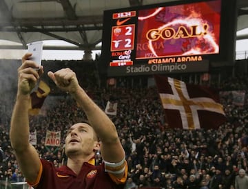 Roma's Francesco Totti celebrates with a selfie