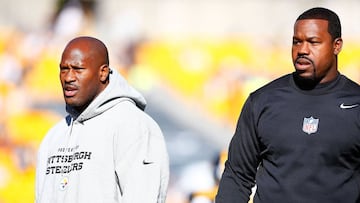 (FILES) This file photo taken on November 14, 2015 shows James Harrison of the Pittsburgh Steelers and outside linebacker coach Joey Porter(R) before the game against the Cleveland Browns at Heinz Field in Pittsburgh, Pennsylvania.   
 Pittsburgh Steelers assistant coach Joey Porter is facing a number of charges, including making terrorist threats, after an alleged incident at a Pittsburgh bar late January 8, 2017, US media reported. Porter, who is also a former player, was arrested just hours after the Steelers 30-12 win over the Miami Dolphins in an National Football League playoff game.
  / AFP PHOTO / GETTY IMAGES NORTH AMERICA / Jared WICKERHAM