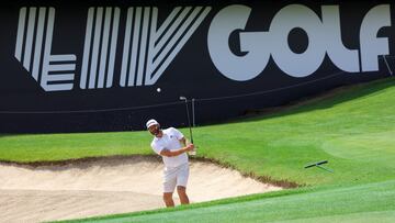 JEDDAH, SAUDI ARABIA - OCTOBER 11: Team Captain Dustin Johnson of 4 Aces GC plays a shot from a greenside bunker on the 18th hole during a practice round prior to the LIV Golf Invitational - Jeddah at Royal Greens Golf & Country Club on October 11, 2022 in King Abdullah Economic City, Saudi Arabia. (Photo by Jonathan Ferrey/LIV Golf via Getty Images)