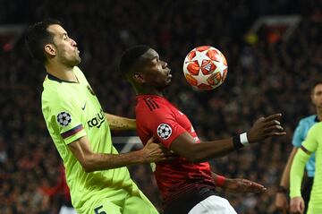 Sergio Busquets y Paul Pogba.