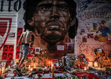 View of an improvised altar set up by Fans of Argentinos Juniors' football team, where Argentinian football legend Diego Maradona used to play, outside Argentinos Juniors' Diego Armando Maradona Stadium in La Paternal neighbourhood, Buenos Aires, on November 25, 2020, on the day of his death. 