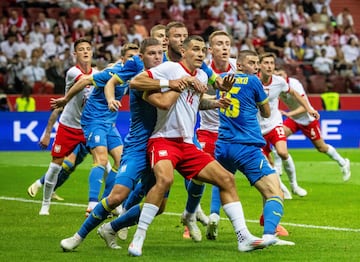 Poland's defender #14 Jakub Piotr Kiwior vies for the ball during the International friendly football match between Poland and Ukraine in Warsaw, Poland, on June 7, 2024. (Photo by Wojtek Radwanski / AFP)