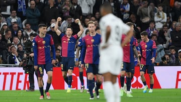MADRID, SPAIN - OCTOBER 26: Robert Lewandowski of FC Barcelona celebrates scoring his team's first goal during the LaLiga match between Real Madrid CF and FC Barcelona at Estadio Santiago Bernabeu on October 26, 2024 in Madrid, Spain. (Photo by David Ramos/Getty Images)