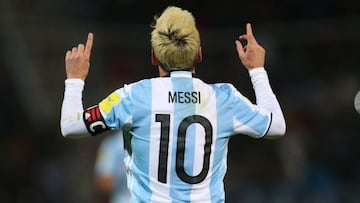 Messi helps Argentina overcome Uruguay and top qualifying group