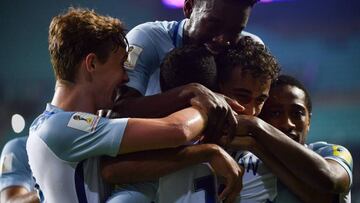 England's forward Ademola Lookman (front C) is congratulated by teammates after scoring during their U-20 World Cup round of 16 football match between England and Costa Rica in Jeonju on May 31, 2017. / AFP PHOTO / KIM DOO-HO
