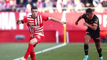 GIRONA, SPAIN - FEBRUARY 05: Miguel Gutierrez of Girona FC being followed by Samuel Lino of Valencia CF during the LaLiga Santander match between Girona FC and Valencia CF at Montilivi Stadium on February 05, 2023 in Girona, Spain. (Photo by Eric Alonso/Getty Images)