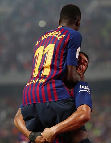 Soccer Football - Spanish Super Cup - Barcelona v Sevilla - Grand Stade de Tanger, Tangier, Morocco - August 12, 2018   Barcelona's Ousmane Dembele celebrates scoring their second goal with Luis Suarez    REUTERS/Sergio Perez