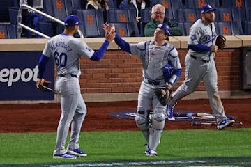 Oct 17, 2024; New York City, New York, USA; Los Angeles Dodgers pitcher Edgardo Henriquez (60) reacts with catcher Austin Barnes (15) after the final out against the New York Mets during game four of the NLCS for the 2024 MLB playoffs at Citi Field. Mandatory Credit: Vincent Carchietta-Imagn Images