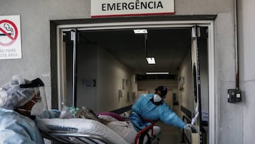 Emergency Rescue Service (SAMU) first responders Lourival da Anunciacao Filho and Cristina Almeida move patient Maria Geralda da Silva, 84, who is experiencing breathing difficulty and others symptoms of the coronavirus disease (COVID-19), into a hospital