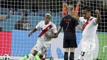 Croatia midfielder Ivan Rakitic (7) and Peru midfielder Renato Tapia (13) react after forward Andre Carrillo (18) scored in the first half of an international friendly soccer match Friday, March 23, 2018, in Miami Gardens, Fla. (Pedro Portal/Miami Herald 