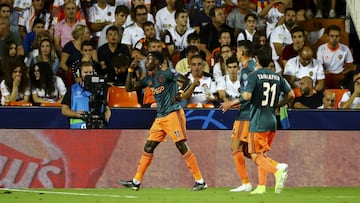Promes of Ajax celebrate after scoring the 0-2 goal with his teammate   during Champions League match between Valencia CF vs AFC Ajax  at Mestalla  Stadium on October 2, 2019.