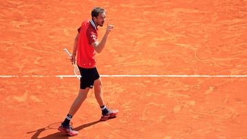 Russia's Daniil Medvedev reacts as he plays against Russia's Karen Khachanov during their Monte Carlo ATP Masters Series Tournament round of 16 tennis match on the Rainier III court at the Monte Carlo Country Club on April 11, 2024. (Photo by Valery HACHE / AFP)