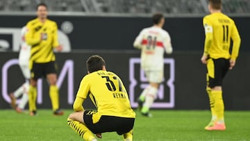 Dortmund's US midfielder Giovanni Reyna (C) and his teammates react after conceding the 1-4 goal during the German first division Bundesliga football match BVB Borussia Dortmund v VfB Stuttgart at the Signal Iduna Park Stadium in Dortmund, western Ge