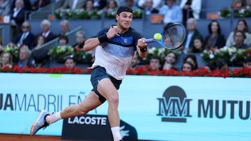 Great Britain's Jack Draper returns the ball to Italy�s Lorenzo Musetti during their 2025 ATP Tour Madrid Open tennis tournament semifinals singles match at the Caja Magica in Madrid, on May 2, 2025. (Photo by Thomas COEX / AFP)