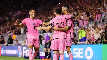 Apr 20, 2024; Fort Lauderdale, Florida, USA; Inter Miami CF defender Sergio Busquets (5) celebrates with forward Lionel Messi (10) and defender Nicolas Freire (21) after scoring a goal against Nashville SC in the first half at Chase Stadium. Mandatory Credit: Sam Navarro-USA TODAY Sports