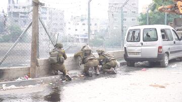 Israeli soldiers operate in Jabalia in the northern Gaza Strip, amid the ongoing conflict between Israel and the Palestinian Islamist group Hamas, in this screen grab taken from a video released on December 9, 2023. Israel Defense Forces/Handout via REUTERS    THIS IMAGE HAS BEEN SUPPLIED BY A THIRD PARTY